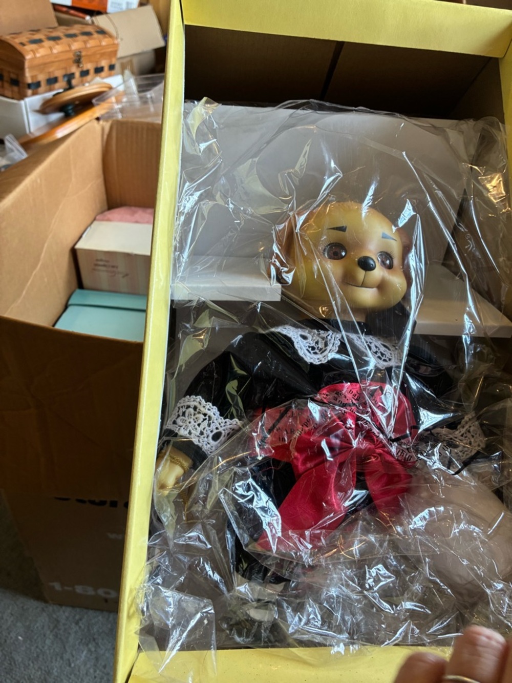 Vintage-style Bear Doll in Black Dress with Red Bow